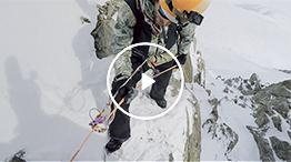 Setting up a rappel during a ski descent