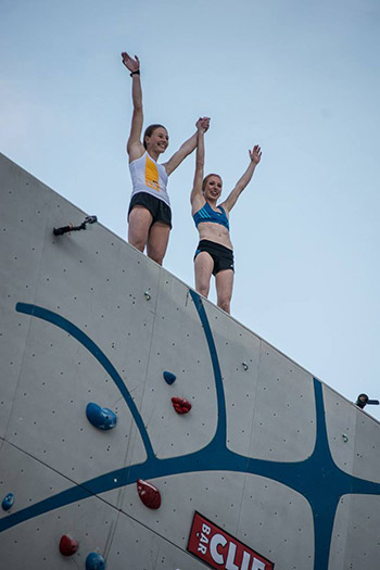 Claire Buhrfeind and Delaney atop the Psicocomp wall. Photo: Justin Roth / Petzl