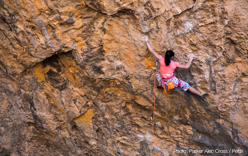 Ashima Shiraishi on Open Your Mind Direct (9a/+) in Santa Linya cave. Photo: Parker Alec Cross / Petzl